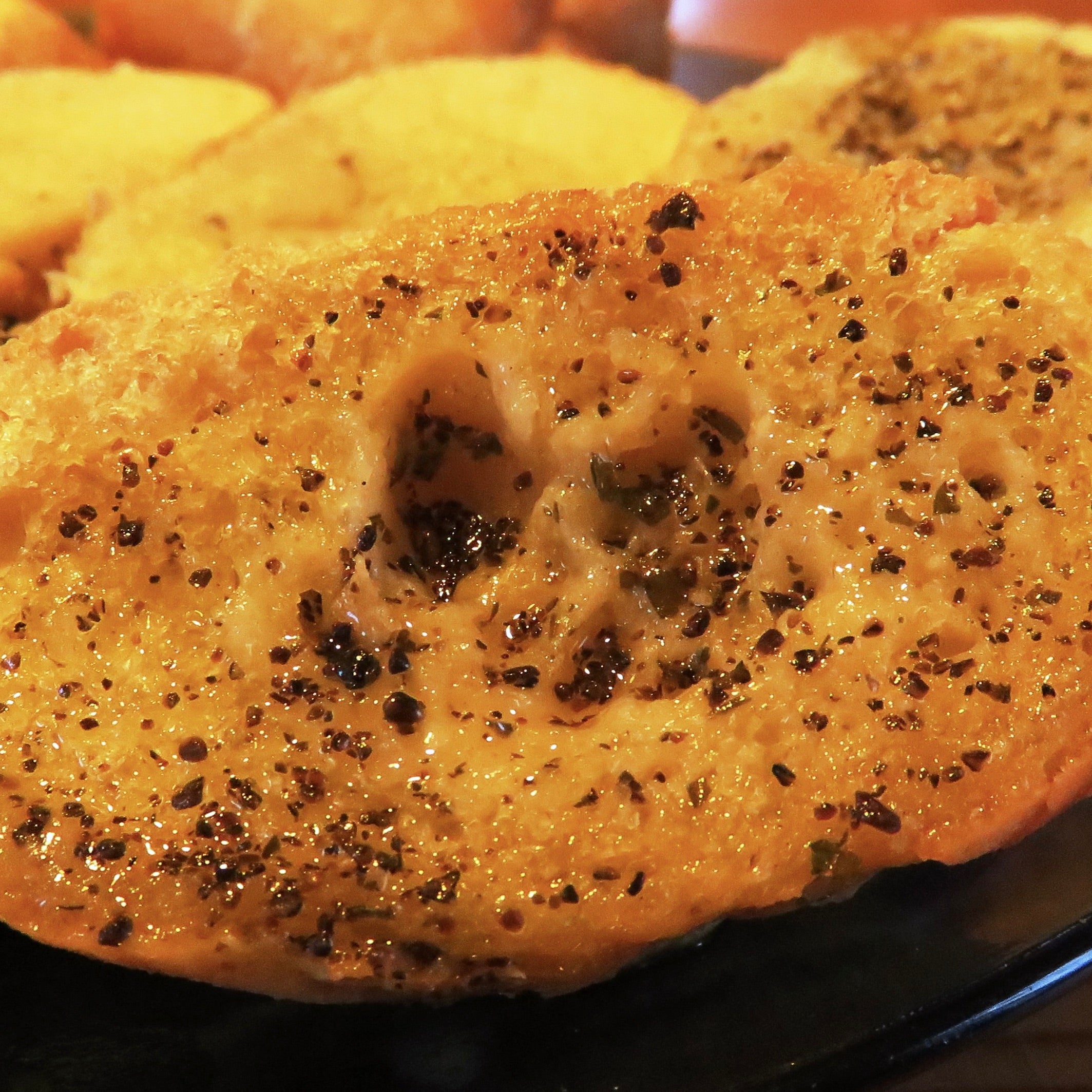 A close up of garlic bread with seaweed recipe and melted butter.